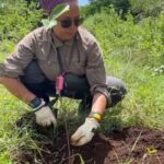 Kelly planting a tree in Tanzania