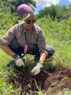 Kelly planting a tree in Tanzania