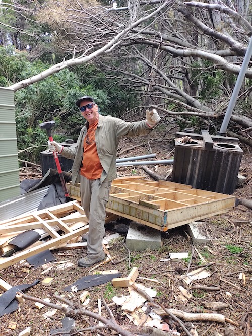 Volunteer Garry Oye cleaning up Italian Camp in Torres del Paine, Chile.