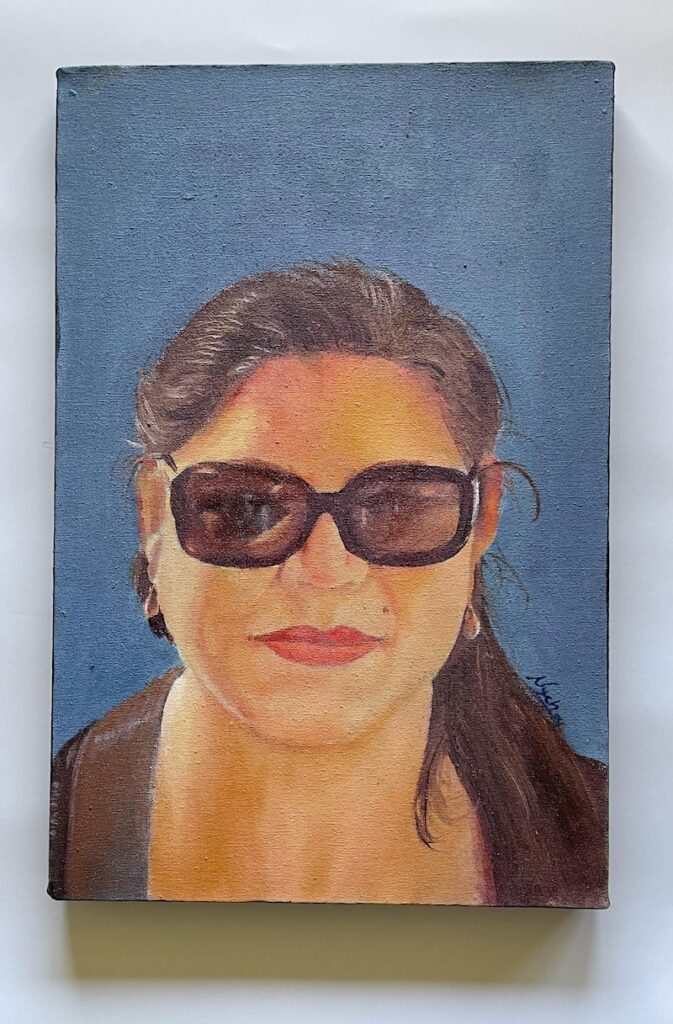 Volunteer leader Millie Flores-Roman's portrait as painted by Juliana.