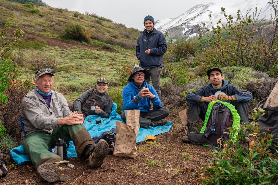 Volunteer leader Garry Oye and trail crew having lunch in Torres del Paine National Park in Chile.